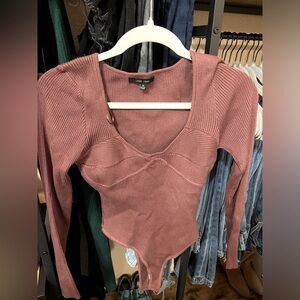 Long sleeve bodysuit. Never worn.